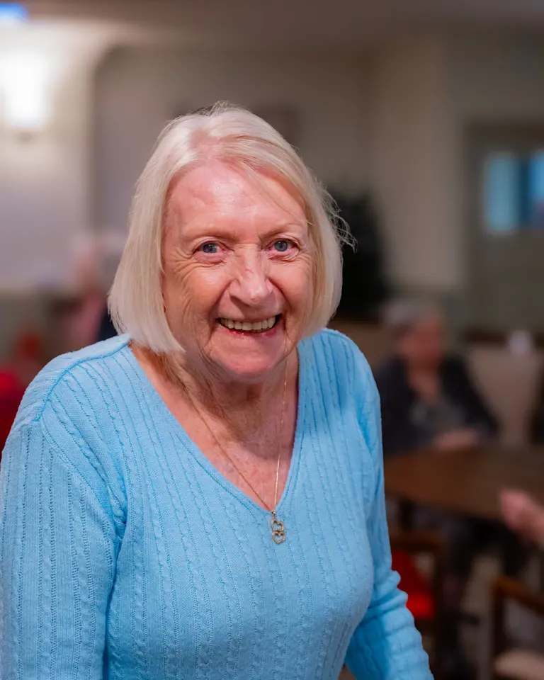 A resident in the lounge at Aria Care Home