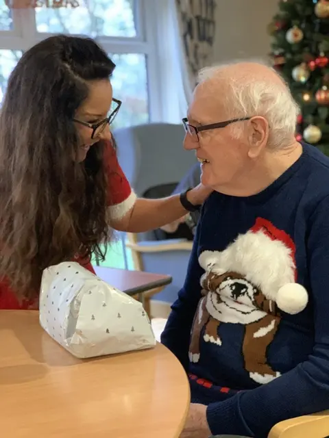 Residents, families and the team celebrating Christmas 2018.