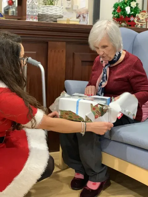 Residents, families and the team celebrating Christmas 2018.